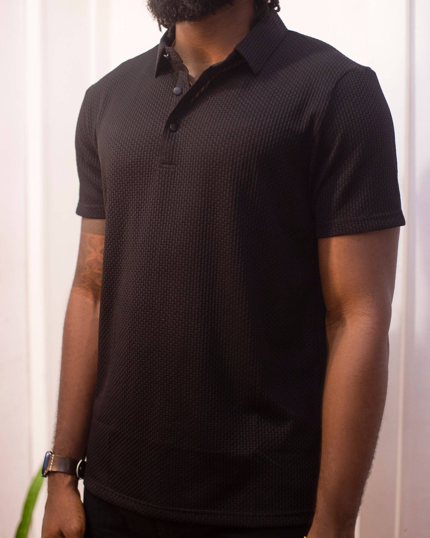 Black short sleeve button up shirt.