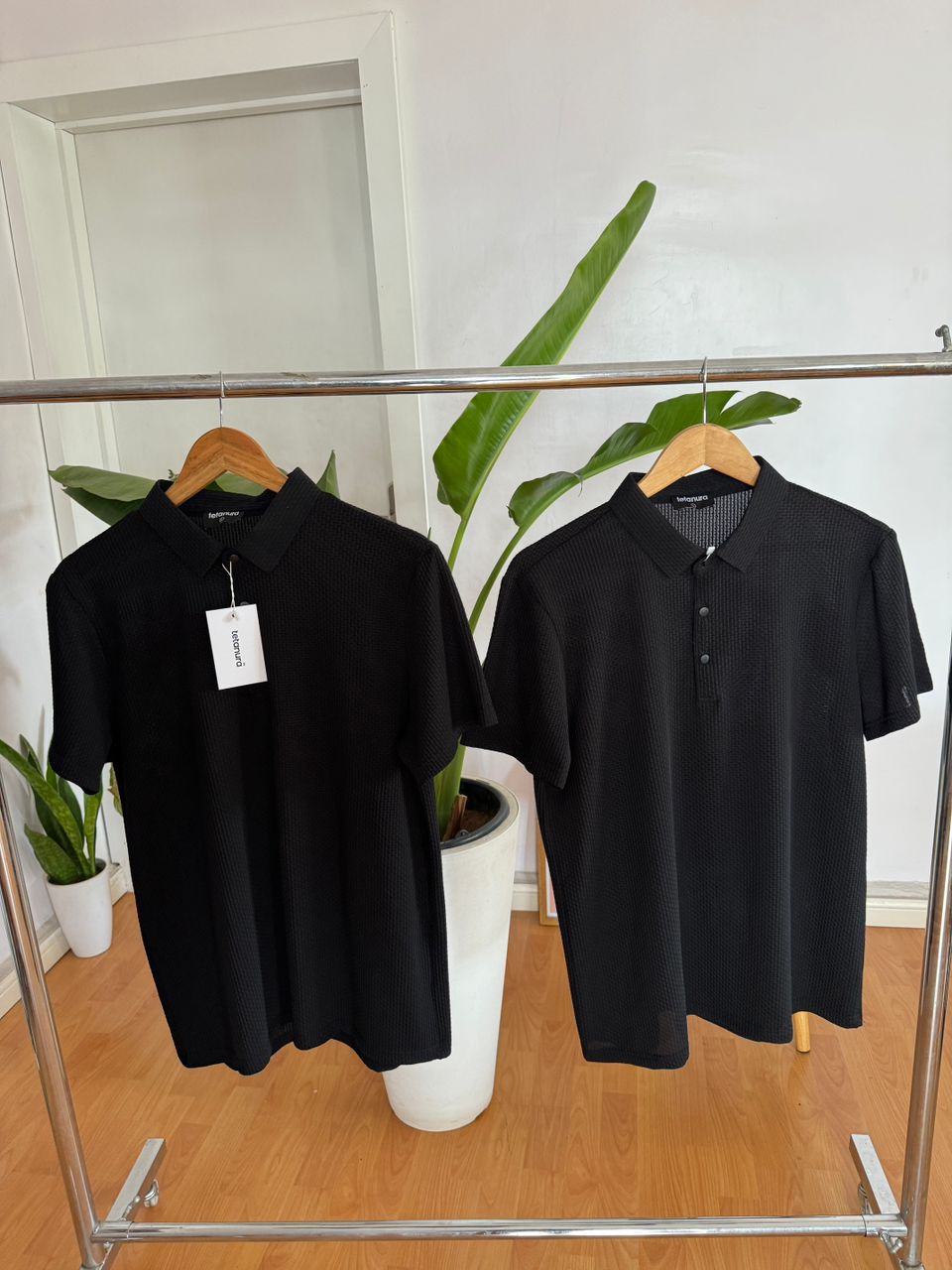 Black short sleeve button up shirt.